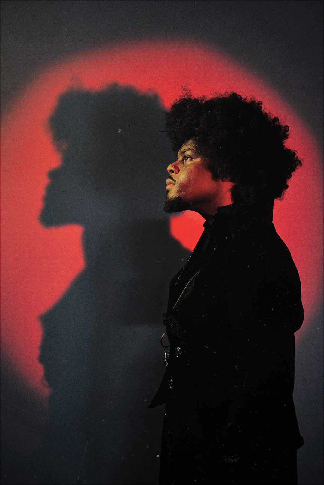 RAKIMISM side profile with a dramatic red shadow